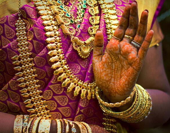 woman gold hand